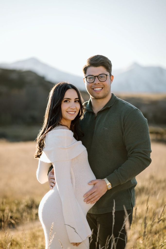 Couple during a maternity shoot in the mountains in Queenstown, New Zealand.