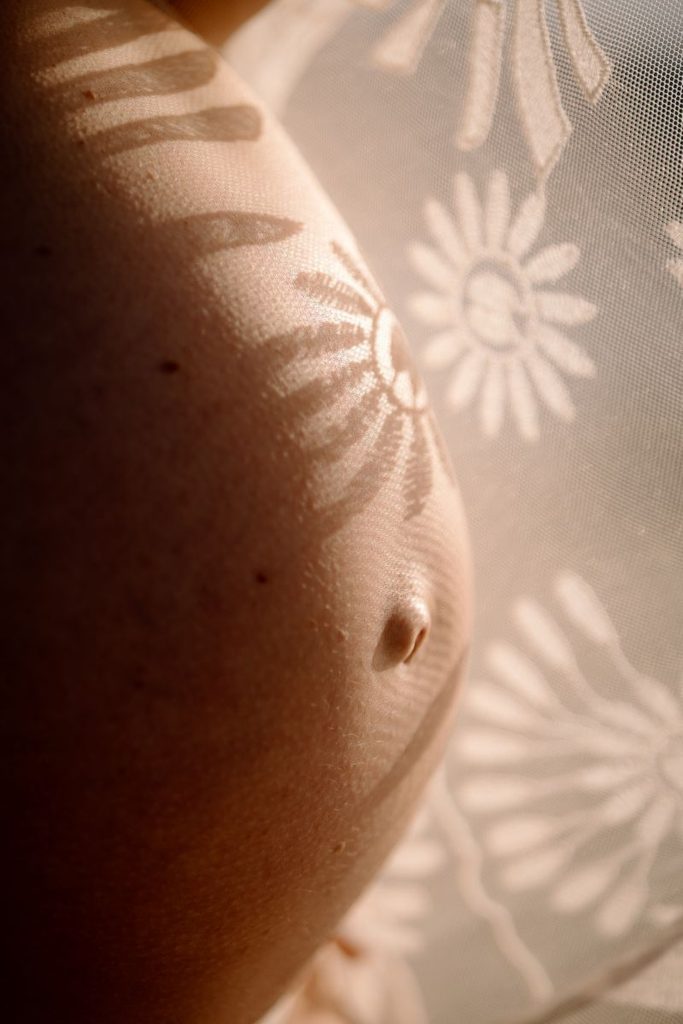 closeup shot of pregnant belly during a maternity shoot in Wanaka, New Zealand