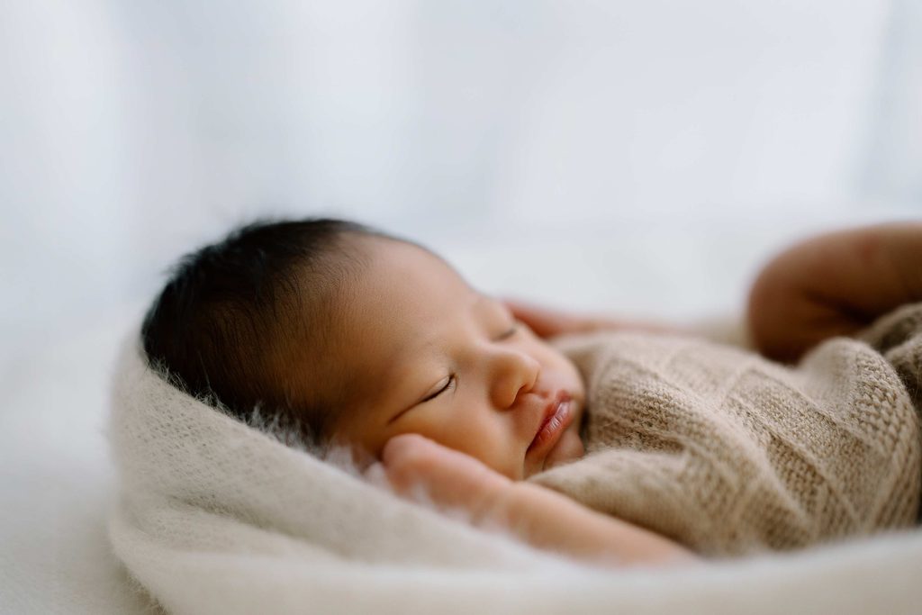 Newborn baby sleeping during newborn photoshoot in Wanaka by Captured by Bie
