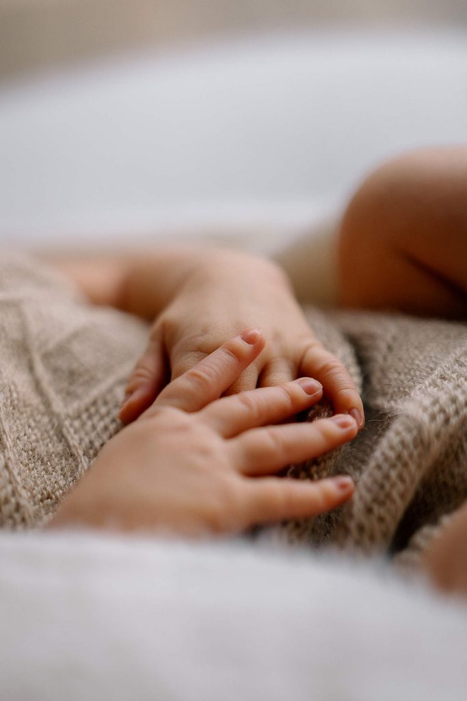 details of hands of newborn baby during newborn photoshoot in Queenstown